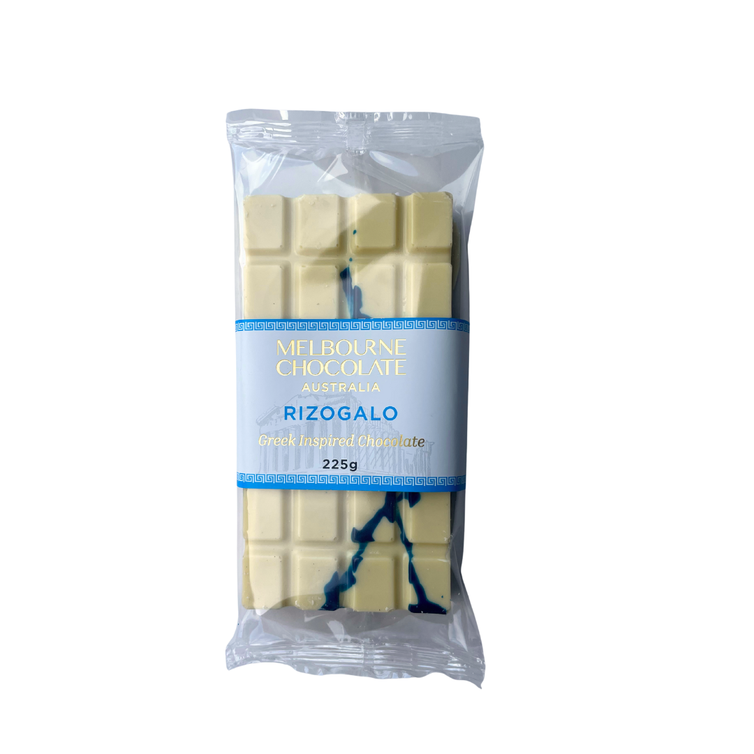 Packaged white chocolate bar with a blue label on a white background