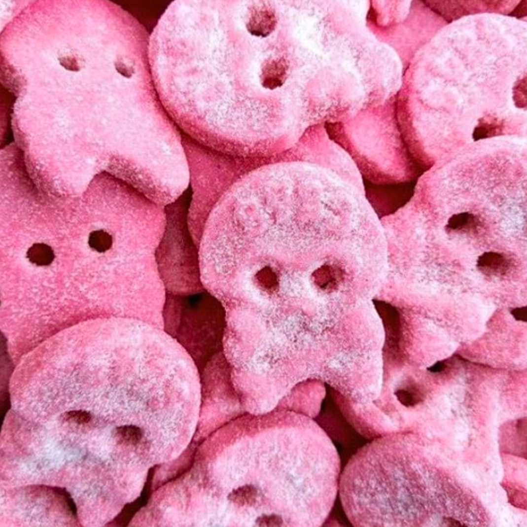 Pink skull-shaped candies with a close-up view