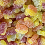 Close-up of colorful gummy bears with a sugary texture.