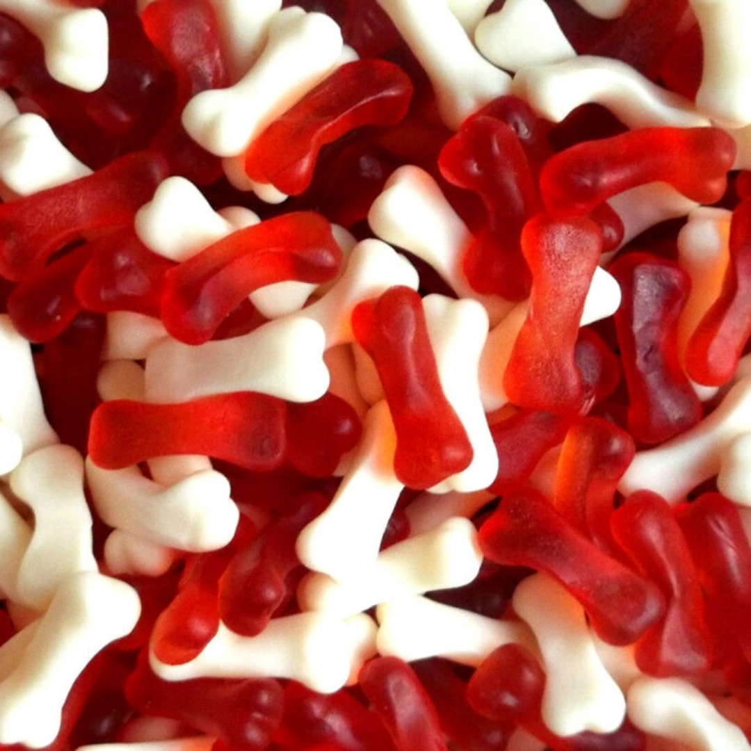 Close-up of red and white gummy worms.