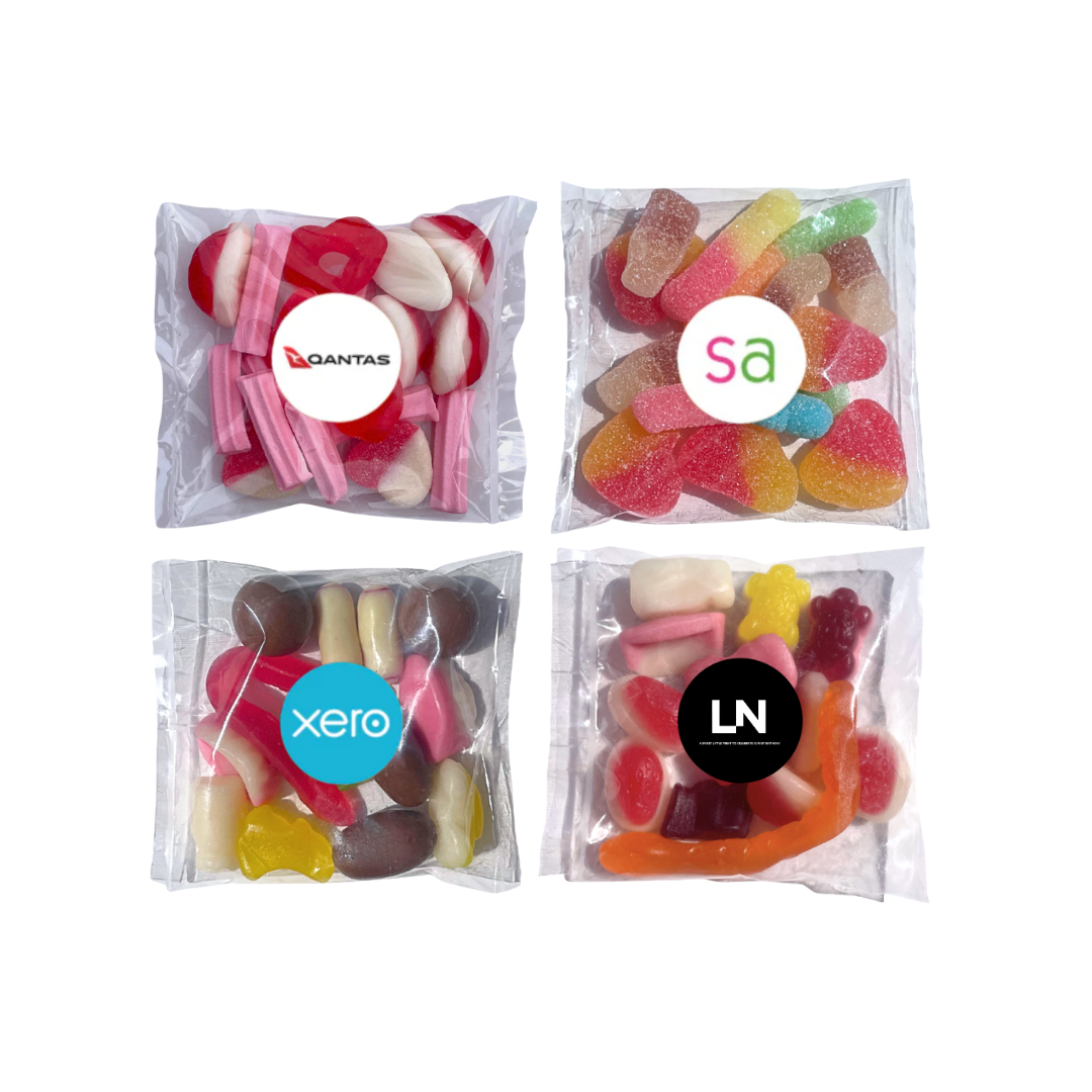Four packages of colorful candies with different companies' logos on a white background