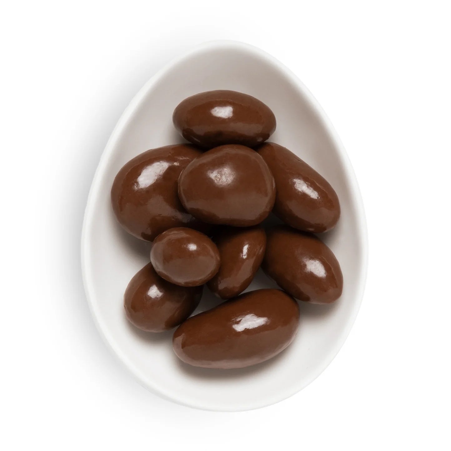 Chocolate-covered almonds on a white plate with a white background