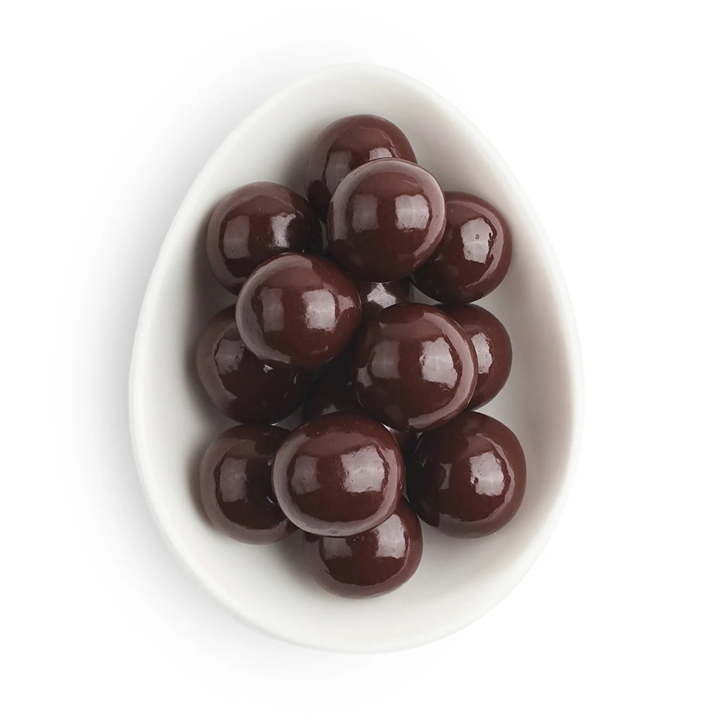Chocolate caramels sweet as sugarfina in a white bowl on a white background