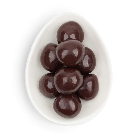 Chocolate candies on a white plate with a white background
