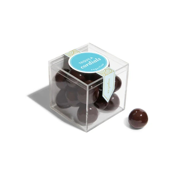 Sugarfina Sugarfina_Tequila_Cordials 
Clear cube box with chocolate candies and a blue label on a white background