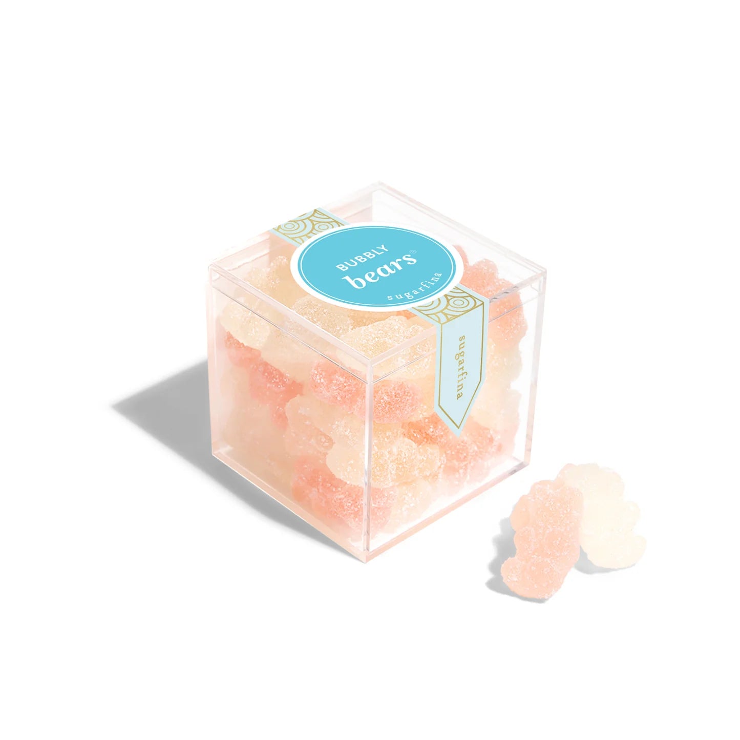 Clear cube box with pink gummy bears and a blue label on a white background