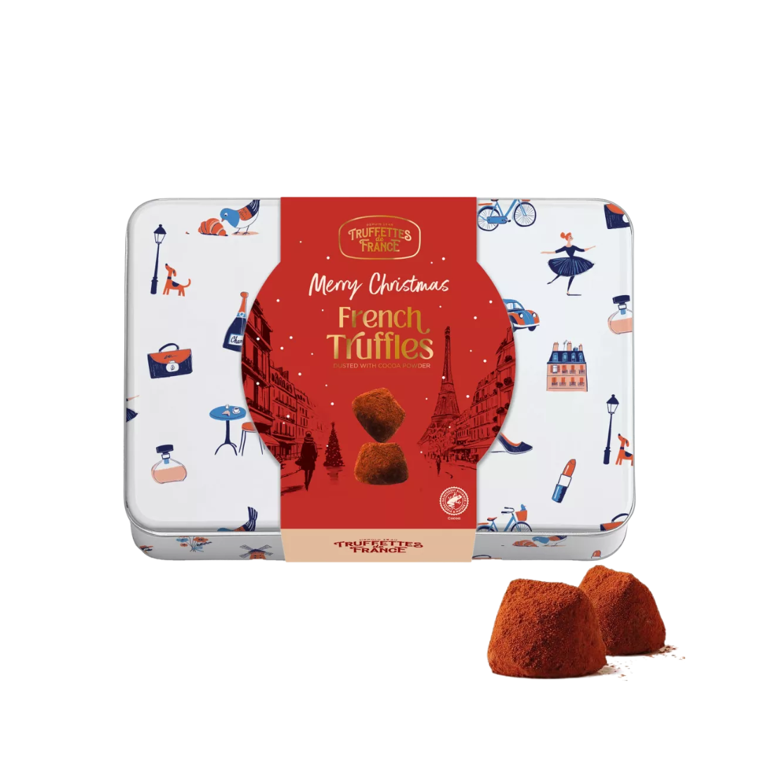 Truffles in a decorative tin with Christmas design on a white background