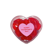 Heart-shaped container of red gummy bears with a pink 'Happy Valentine's Day' heart on a white background