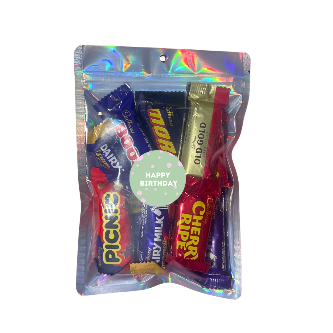 Packaged assorted candy bars with a 'Happy Birthday' card on a white background